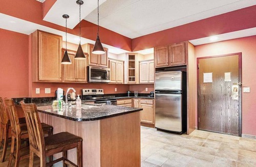 Wisconsin Dells Apartment | Serene river-view condo + perks + two fireplaces