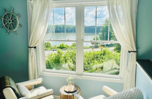 Aurora Condo | SKY Parlor sunrise and sunset views overlooking the river
