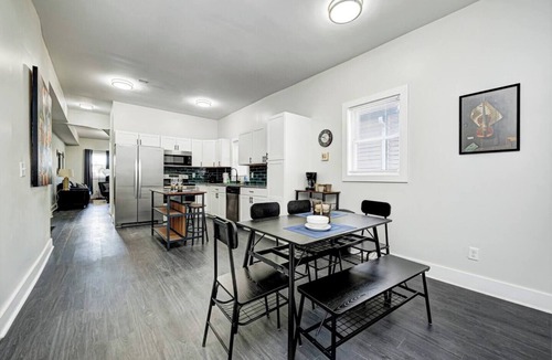 Fountain Square House | Sleeps 6 comfortably: 3 stylish bedrooms with plush bedding and blackout curtains. Music-themed decor: curated vinyls, vintage instruments, and artwork. This short-term rental features bold décor, modern amenities, and walkable access to