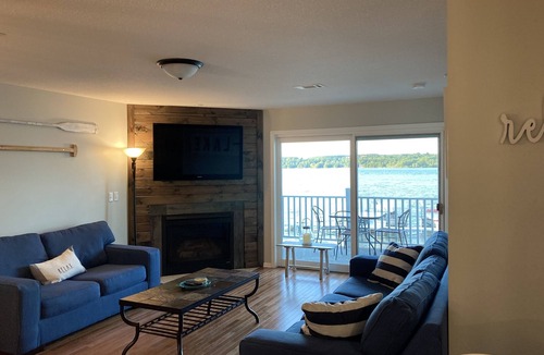 East Jordan Condo | South Shore Haven - Lake Charleviox Waterfront Condo