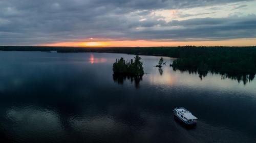 Babbitt Boat Rental | Spacious Cabin-Style Houseboat with Water Slide and Upper Deck Views Near Birch Lake, Babbitt, MN