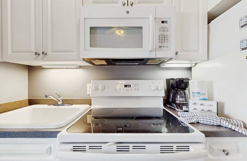 Gulf Place Apartment | Spacious condo with large living area, private balcony & shared pool