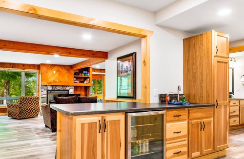 Presque Isle Cabin | Spacious lakefront lodge with fireplaces, WiFi, W/D, dock, & resort game room
