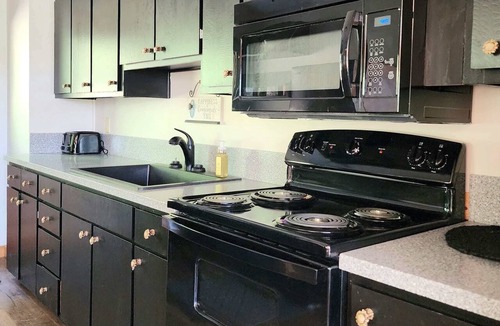 Logan Cabin | Spacious Lodge with Stocked Pond, Hot Tub, Games