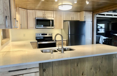 Interlochen House | Spacious log home on Green Lake. Waterfront. Dog ok.
