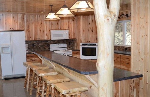 Park Rapids Resort | Spruce with two story high windows with loft on the premier lake of Big Sand