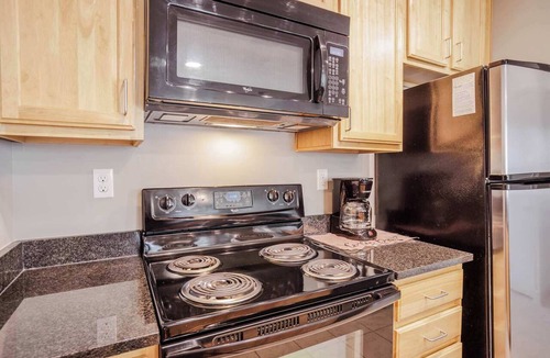 Central Business District Apartment | Stylish 1BR/1BA CozySuites at the Banks