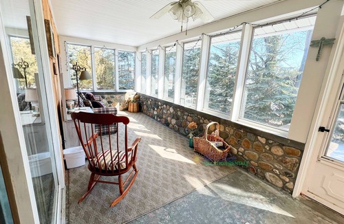 Suttons Bay House | Suttons Bay farmhouse-style home. Five bedrooms. Air conditioning. Dog okay