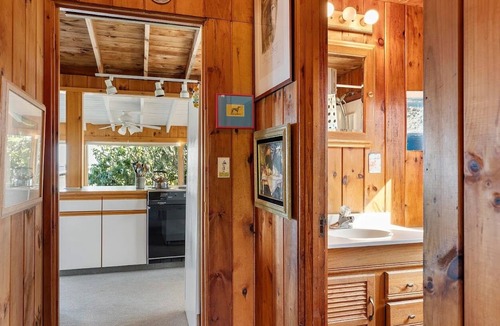 Mid-Coast and Islands Cottage | The Yellow Cottage is a 2-bedroom little getaway located right on its own private beach.