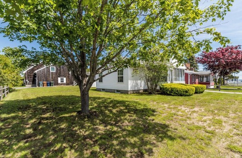 Southern Coast Cottage | This charming cottage boast an enclosed porch for the beautiful Ocean Views!