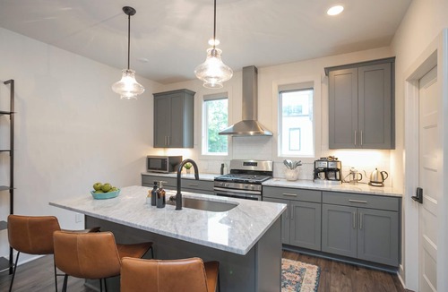 Katie Hill Neighborhood House | Townhome with Balcony Suites & Garage