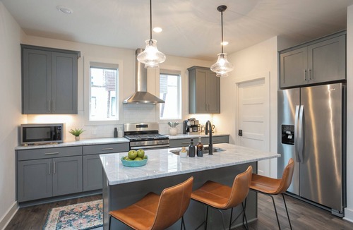 Katie Hill Neighborhood House | Townhome with Balcony Suites & Garage