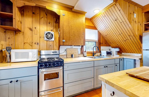 Raymond Cottage | Tranquil cottage near beach with private dock, spacious patio & modern comforts