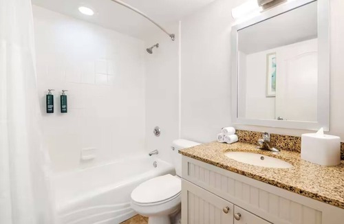 Elrod Estates Hotel | Two Coastal 2BR Units for Pool Relaxation, Ocean Walks & Family Fun