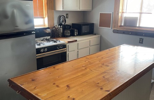 International Falls Cabin | Unique Furnished Loft Style Space Converted Historic Bar Ideal for Extended Stay