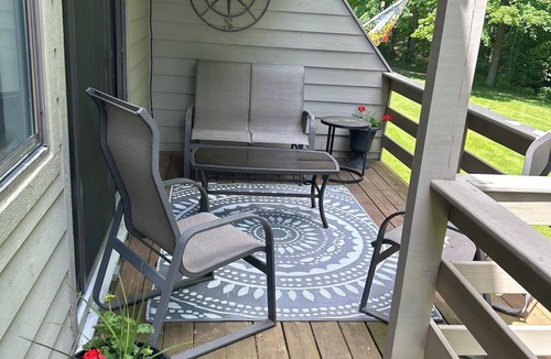 Harbor Springs Condo | Updated wooded 3 BR end unit condo, sunrise view, pool, trails, close to Lake MI