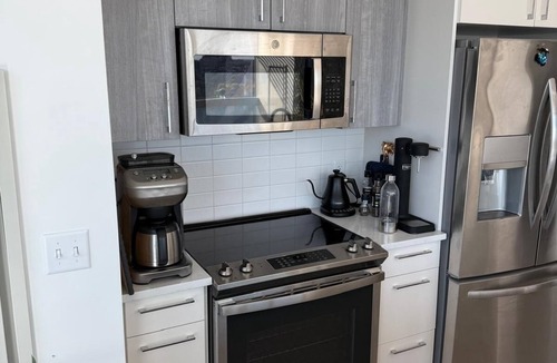 MIT Apartment | Upscale home with breathtaking view, full kitchen, living room and balcony
