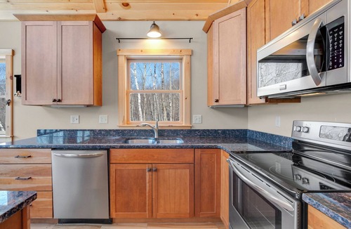 South Pond Shores Ski Chalet | Waterfront Chalet: 4BR Luxury w/Game Room, Private Dock & Minutes to Skiing!