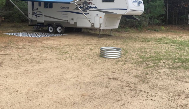 27 foot fifth wheel on a small private campground. Pets allowed.