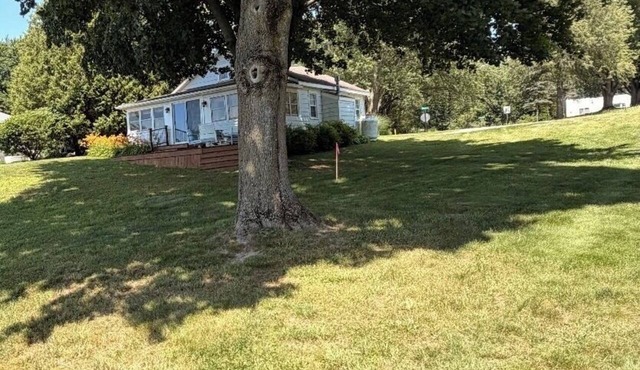 3-bedroom lakefront home on All-sports lake with private beach and dock.