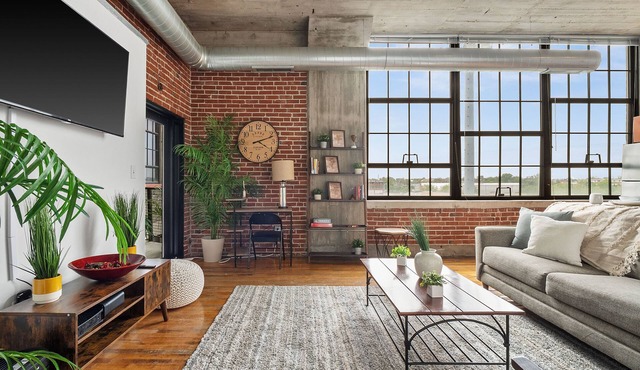 5th floor loft featuring a private balcony