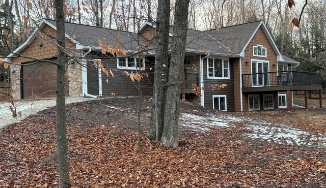 Beautiful new home nestled on 5.5 acres of Lake Michigan sand dunes