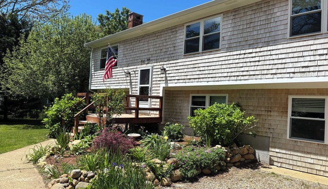 Beloved 5-bedroom house with Beach Passes, AC, fenced in yard, and hot tub