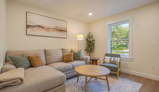Charming 2-bedroom apartment nestled in a quiet neighborhood with nearby stream.