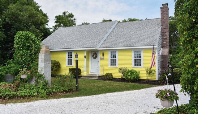 Charming, well appointed home has hardwood floors and ceiling fans throughout