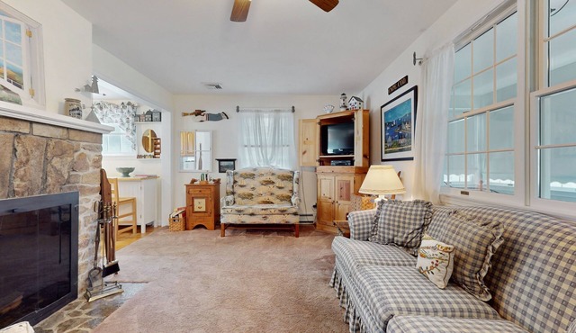 Coastal dog-friendly cottage near Hen Cove with sunroom, beach access, & games