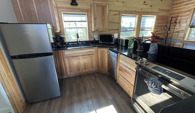 Cozy cabin in charming Logan with AC, WiFi, Hot tub, Firepit