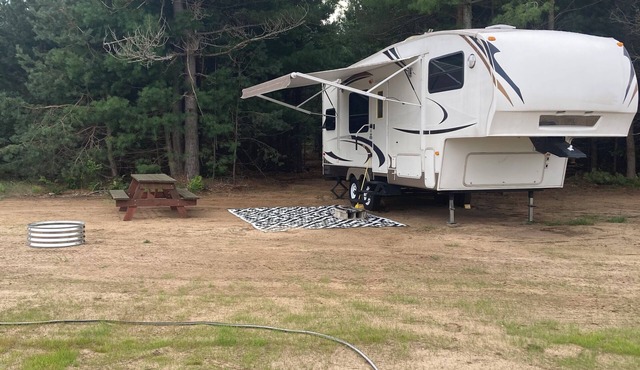 Cozy fifth wheel located on a private campground in Interlochen.