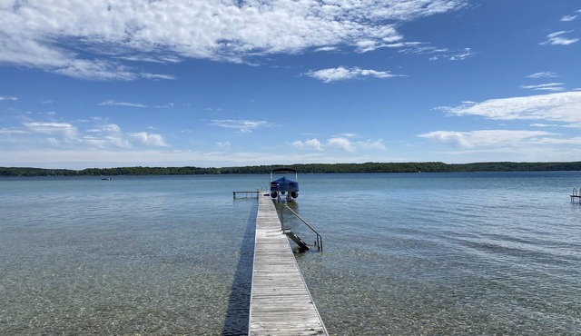 Crystal Lake Waterfront Cottage with Private Dock, Yard, & Hot Tub