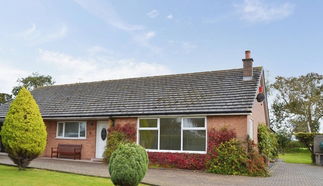 Detached bungalow within extensive private garden.