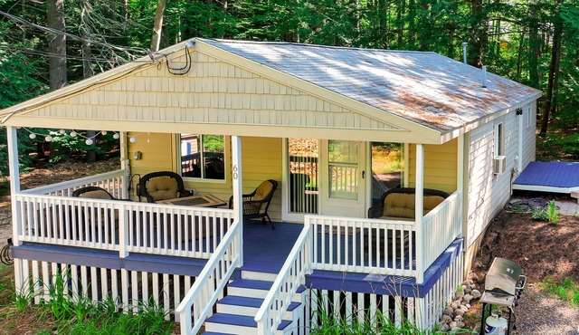 Dog-friendly cottage with lake access, EV charging, firepit, & washer/dryer