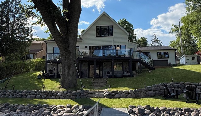 Escape to this completely renovated luxury lakefront retreat on Okauchee Lake!