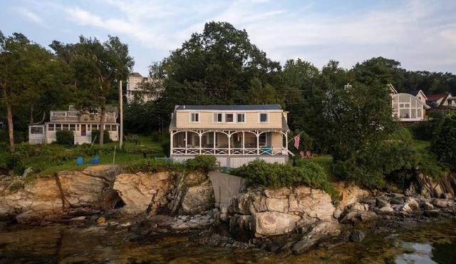 Evergreen cottage 5' from the water with private beach.