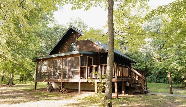 Genuine Log Cabin with large yard in a small quaint town across from Fish Lake