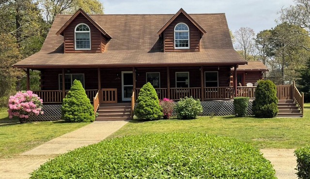 Indulge in the ultimate vacation experience at this exquisite custom log home.
