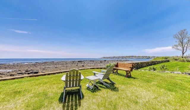 Inviting oceanfront home with fireplace, firepit, & views from every room