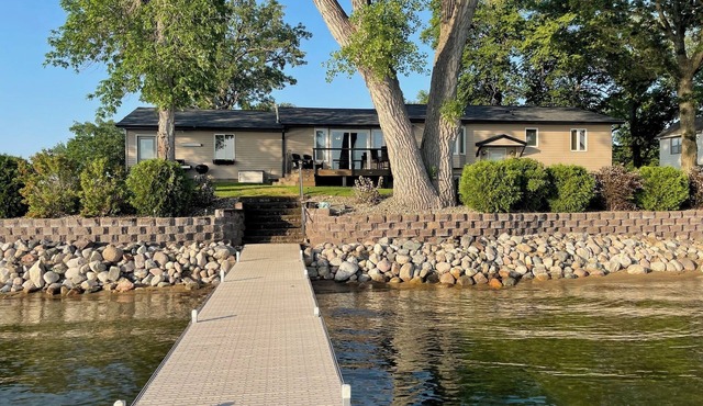 Lake home with beautiful views, private sandy beach, great location.