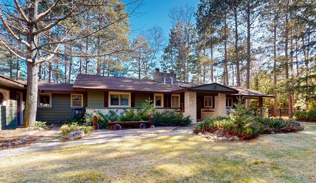 Lakefront house with private covered hot tub, dock, wood fireplace, & firepit