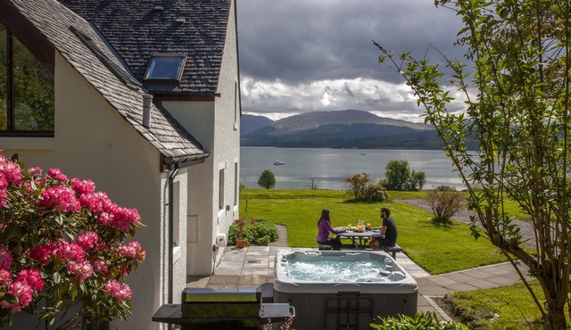 Large cottage on shore of Scottish Loch