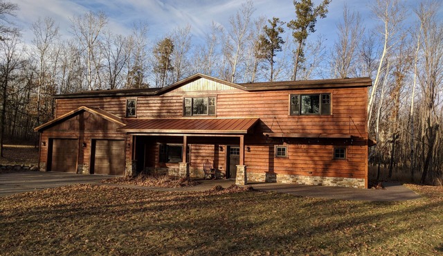 Large lake front cabin, has 2 kitchens and comes with a pontoon! Bring the fam!