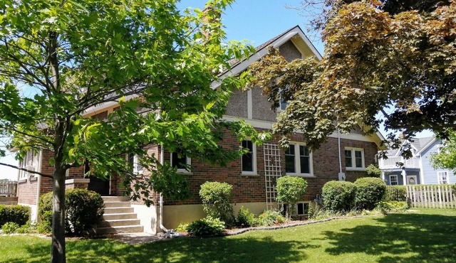 Large Summer House with the stunning views, four bedrooms, deck and hot tub!