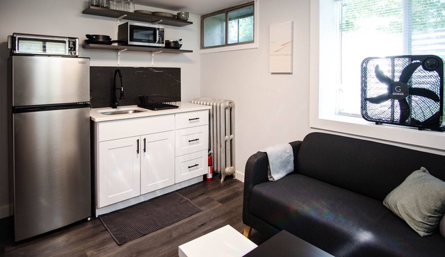 Modern 1 bed basement unit for traveling professionals with garage and laundry
