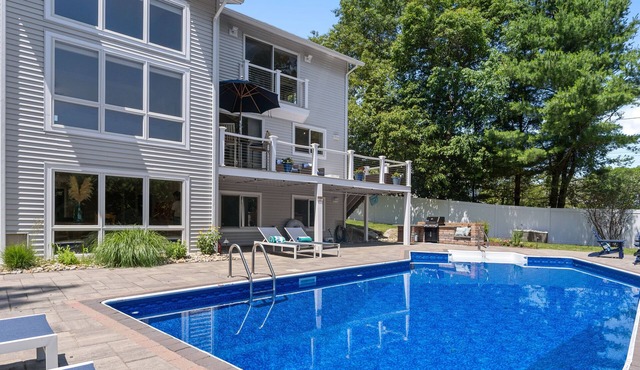 Modern coastal retreat w/pool, close to beaches and golf courses.