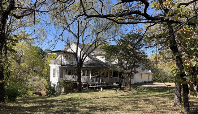 Nestled in a wooded 40-acre lot 25 min to State Capitol and KU and12 min to I 70