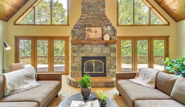 NEW LISTING! KAYAKS + SUPS. Timber Ridge Lake House is a private home in Amery Wisconsin on Lake Wapogasset. The home balances the warmth of a large A-Frame with modern decor and finishes providing a serene stay with woods and lake views.