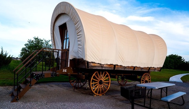 Perfect Glamping Vacations in this Rustic Conestoga Covered Wagon Rental in Oklahoma